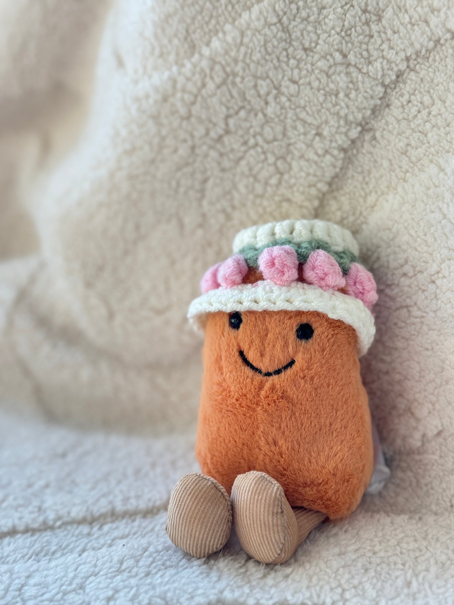 Cute Jellycat Amuseables Bean styled with a handmade tulip bonnet inspired by spring flowers and cottagecore aesthetics.